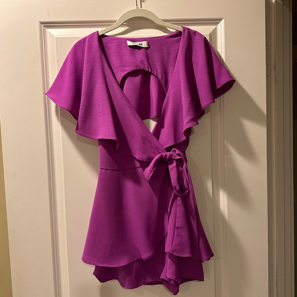 Pinkish purple romper with tie in front and open back